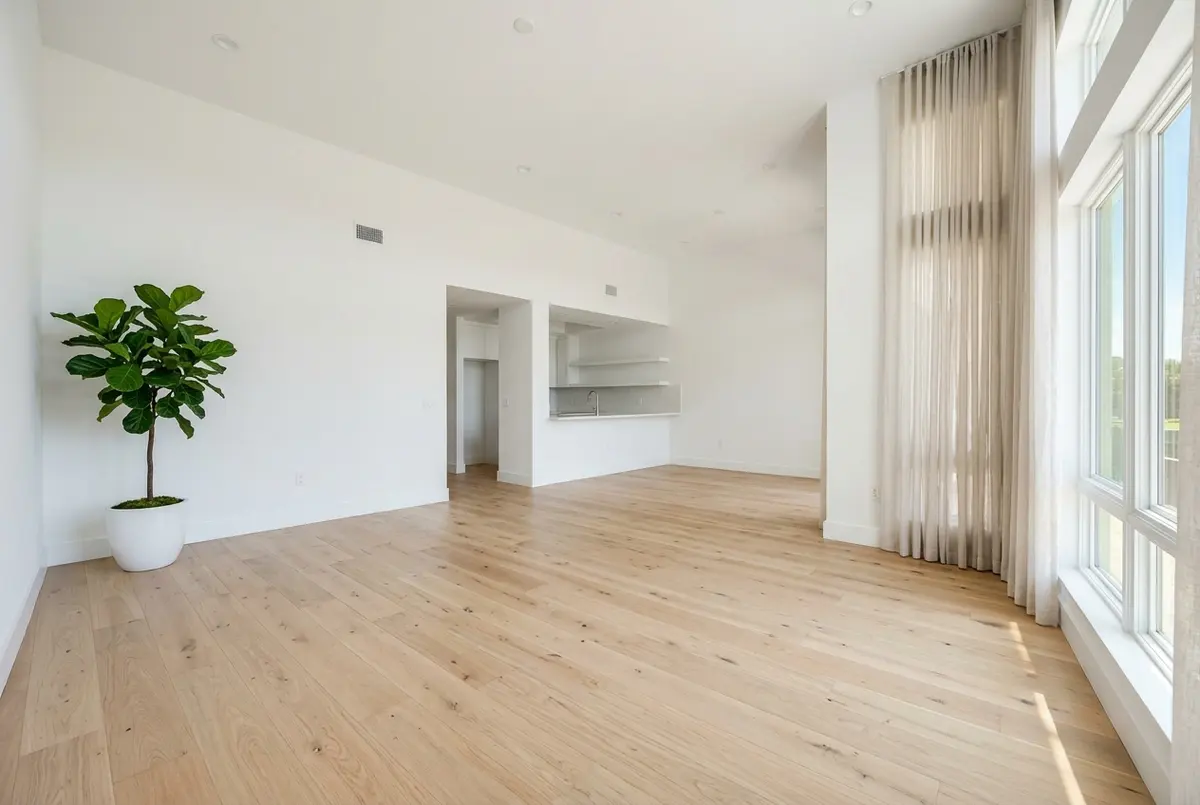 New wide-plank light oak hardwood floor